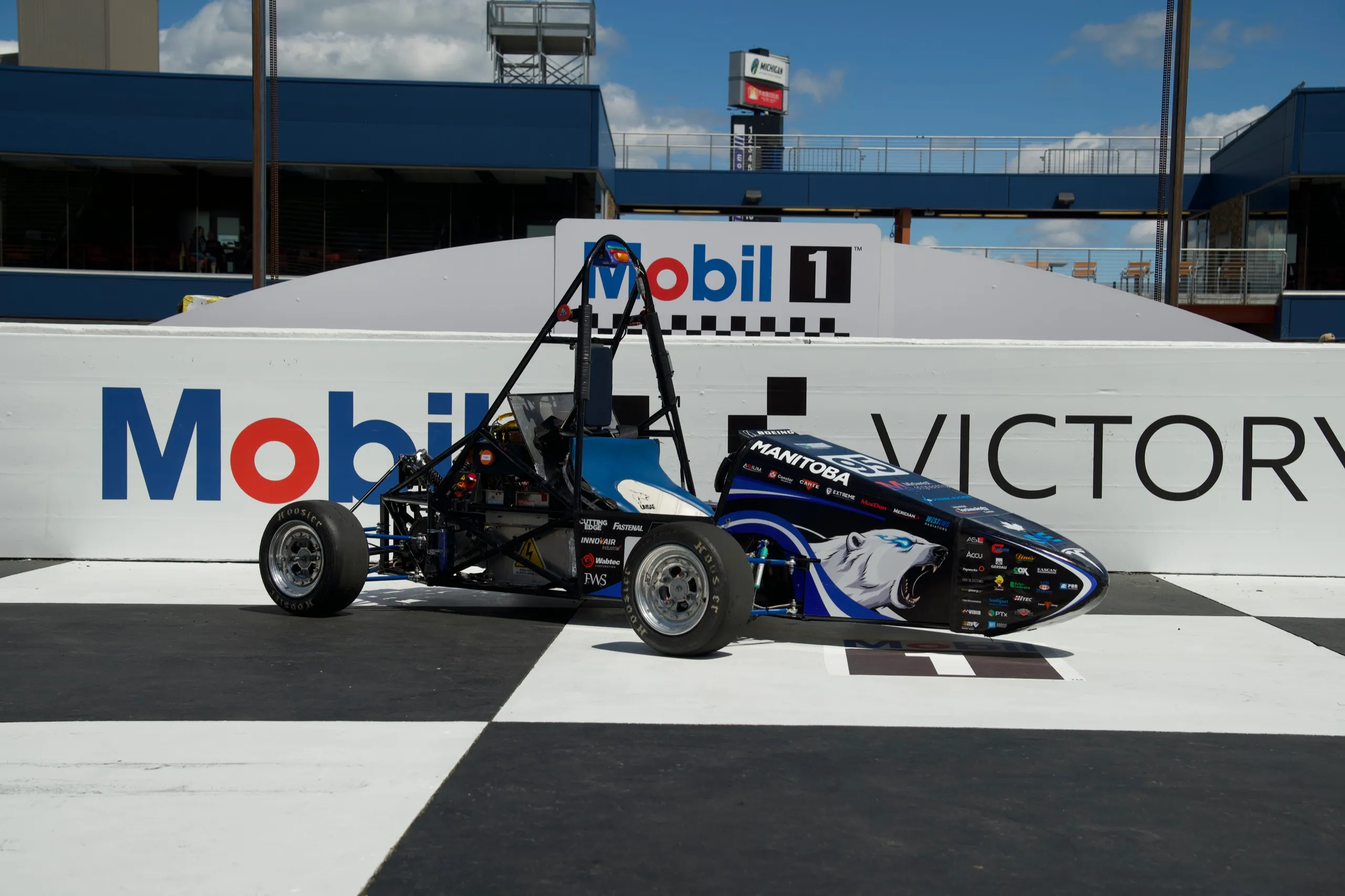 Car at victory lane, front three quarter