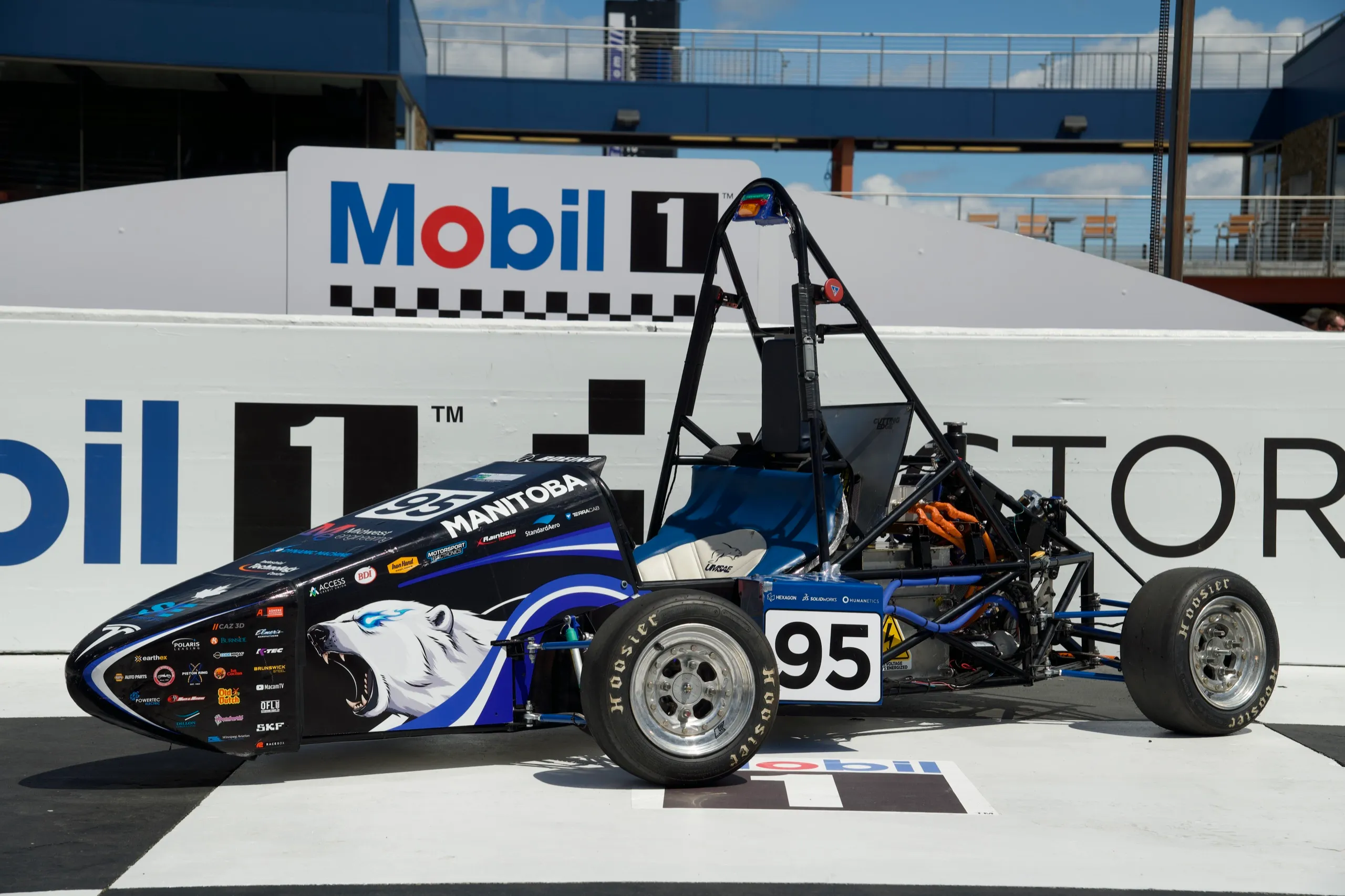 Car at victory lane, side profile