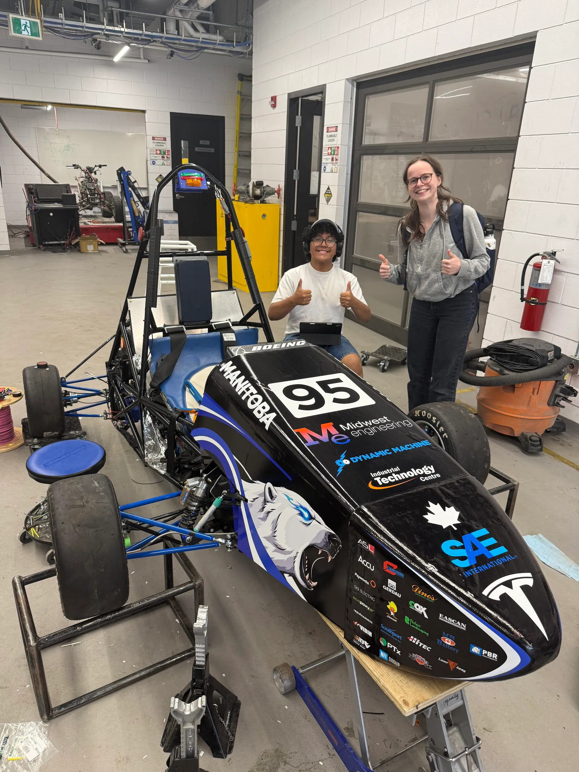 Car in the shop before a test, June 11